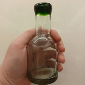 Antique seamless green glass bottle